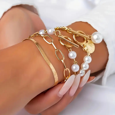 Set of 4 Chic Gold Bracelets – Snake, Pearls, and Links | Gold