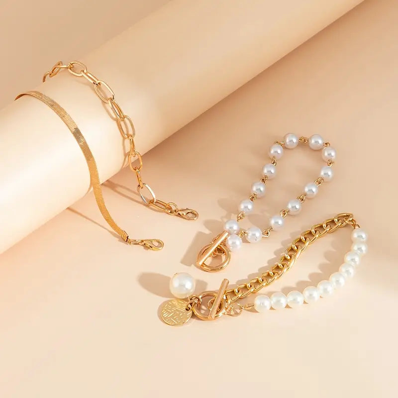 Set of 4 Chic Gold Bracelets – Snake, Pearls, and Links | Gold